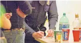  ?? JOURNAL ?? An APD officer writes a citation to underage drinkers at a party near UNM in 2006. The City Council voted Monday to fund a new program hoping to combat underage drinking, drug use and violence.