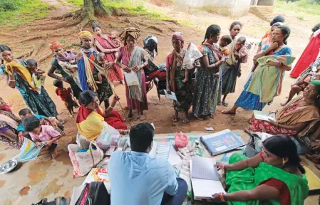  ??  ?? Bonda women and children gather to get immunisati­on services. Social audits though say that healthcare facilities are poor and irregular