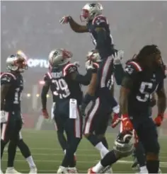  ?? STAFF PHOTO BY MATT WEST ?? RISING UP: The Pats defense celebrates after a big fourthdown stop against the Falcons in the fourth quarter.