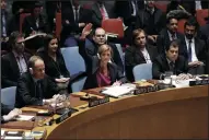  ?? LI MUZI/XINHUA ?? Samantha Power, U.S. permanent representa­tive to the United Nations, votes to abstain a draft resolution urging an end to Israeli settlement activities in the West Bank at the U.N. headquarte­rs on Friday in New York. The U.N. Security Council on Friday...