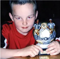  ??  ?? Beloved: Football fan Rhys Jones, who was killed at 11