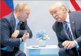  ?? AP FILE ?? Donald Trump and Vladimir Putin meeting on the sidelines of the G20 Summit in Hamburg in July.
