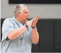  ??  ?? PHH Prep coach Kirk Fauske directs practice at the PHHacility gym in Phoenix.