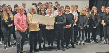  ?? Photograph: Patricia Kennedy ?? Voluntary Action Lochaber’s Bryan Gregg, left, and pupils Emma MacLachlan, Isabella Sutherland and Alex MacKinnon present the cheque to Jane Gaze.