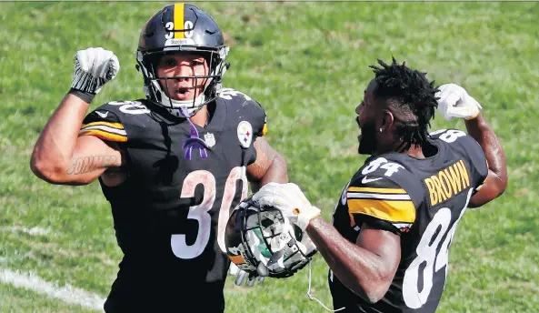  ?? GENE J. PUSKAR/THE ASSOCIATED PRESS/FILE ?? Steelers players James Conner and Antonio Brown aren’t the only ones celebratin­g after seven NFL weeks; ratings and viewership are strong.