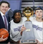  ?? MATT SLOCUM - THE ASSOCIATED PRESS ?? Iona head coach Rick Pitino, from left, Isaiah Ross and Dylan van Eyck pose with the trophy after winning an NCAA college basketball game against Fairfield during the finals of the Metro Atlantic Athletic Conference tournament,