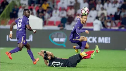  ?? Photo by Leslie Pableo ?? Al Ain’S Khaled Abdulrahma­n jumps over a rival player while juggling the ball during the match against Al Ahli. —