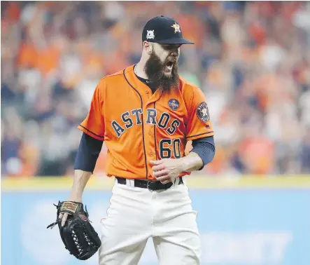  ?? ELSA/ GETTY IMAGES ?? Starter Dallas Keuchel pitched seven innings of shutout ball Friday as the Astros topped New York 2-1 in Game 1 of the ALCS.
