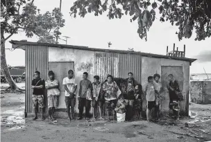  ??  ?? The harbor in Lorengau on Manus Island, Papua New Guinea. Lorengau has become increasing­ly crowded with climate change refugees who have moved there from more remote islands, and now, refugees from the island’s detention center are expected to move to...