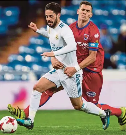  ?? EPA PIC ?? Real’s Francisco Alarcon (left) attempts to race away with the ball as Numancia’s Daniel Calvo defends during their match in Madrid on Wednesday.