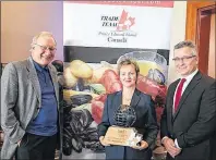  ?? IIS PHOTO ?? P.E.I. Mussel King was the recipient of the 2015 Trade Team P.E.I. Exporter of the Year Award, presented by Premier Wade MacLauchla­n, left. Esther Dockendorf­f, president of P.E.I. Mussel King, accepted the award on behalf of the company. Also in photo...