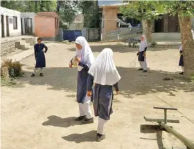  ?? Photo: Neelam Pandey / HT Photo ?? After their schools were burnt by unidentifi­ed men during protests over Burhan Wani’s killing, Kashmiri students struggle to study in classrooms with broken roofs and windows.