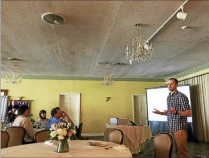  ?? PHOTOS BY BEN LAMBERT — THE REGISTER CITIZEN ?? Noah Cass, a Marine who served two tours in Iraq and found long-distance running helped him in his return to civilian life, shared his story with the Torrington-Winsted Rotary Club Tuesday.