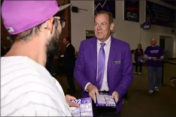  ?? HYOUNG CHANG/THE DENVER POST ?? Rockies owner Dick Monfort welcomes fans at the main entrance for Opening Day at Coors Field in Denver on April 8.