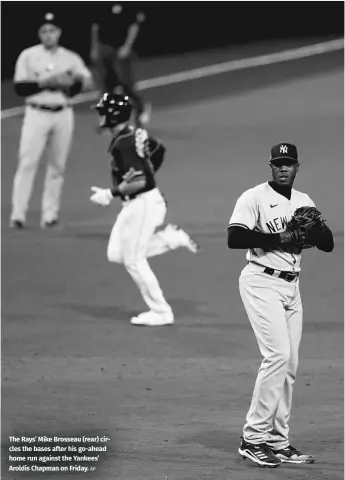  ?? AP ?? The Rays’ Mike Brosseau (rear) circles the bases after his go-ahead home run against the Yankees’ Aroldis Chapman on Friday.