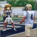  ?? Tim Godbee ?? Calhoun junior tight end Emaree Winston, shown here hitting a blocking pad, is one of the many veterans the Yellow Jackets have returning this fall from a team that went 9-4 last year.