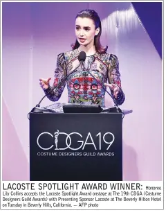  ??  ?? Honoree Lily Collins accepts the Lacoste Spotlight Award onstage at The 19th CDGA (Costume Designers Guild Awards) with Presenting Sponsor Lacoste at The Beverly Hilton Hotel on Tuesday in Beverly Hills, California. — AFP photo