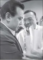  ?? GEREMY PINTOLO ?? Sen. Antonio Trillanes IV shakes hands with presidenti­al spokesman Harry Roque after a Senate inquiry on fake news yesterday.