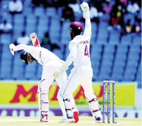  ?? RICARDO MAZALAN PHOTOS ?? West Indies’ Shai Hope celebrates the dismissal of India’s KL Rahul during day one of the first Test cricket match at the Sir Vivian Richards cricket ground.