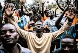  ?? LUIS TATO/GETTY-AFP ?? Opposition supporters rally Wednesday in Nairobi on the eve of the presidenti­al vote.