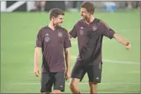  ?? (AFP) ?? Germany’s midfielder Jonas Hofmann and forward Thomas Muller during a training session at the Al Shamal Stadium on Tuesday.