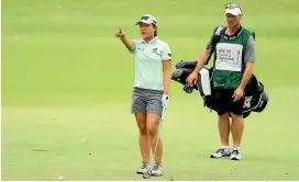  ?? PHOTO: GETTY IMAGES ?? Lydia Ko with Gary Matthews at the HSBC Women’s Champions event in Singapore last night.