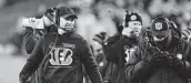  ?? Emilee Chinn / Associated Press ?? Bengals coach Zac Taylor, left, started his career signaling plays for A&M under Mike Sherman.