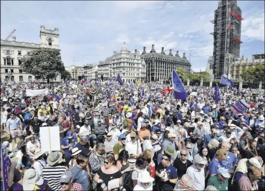  ?? John Stillwell The Associated Press ?? Crowds arrive Saturday in London’s Parliament Square during the People’s Vote march for a second EU referendum.