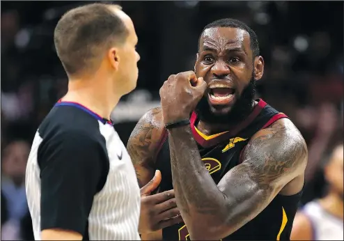  ?? GETTY IMAGES ?? The Cavaliers’ LeBron James argues with referee John Goble after a foul call against the Golden State Warriors during Game 3 of the NBA Finals on Wednesday night at Quicken Loans Arena in Cleveland.