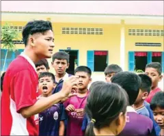  ?? SUPPLIED ?? Tith Sovannara coaches a group of children as part of his project called ‘Play to Progress’.