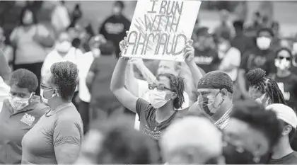  ?? STEPHEN B. MORTON/AP ?? Protesters decry the fatal shooting of Ahmaud Arbery during a demonstrat­ion this month in Brunswick, Georgia.