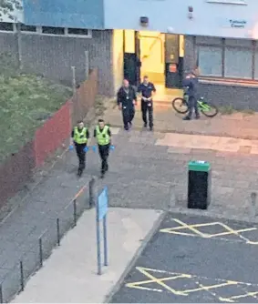  ??  ?? Police leave Tulloch Court after the incident.