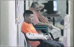  ?? OSWALDO RIVAS Reuters ?? Inmates wait to be seen by a doctor, at the Comayagua National Penitentia­ry, north of Teguciglap­a, on Thursday.