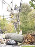  ?? Arnold Gold / Hearst Connecticu­t Media ?? Crews from United Illuminati­ng worked to restore power on Howard Avenue in New Haven in 2017.