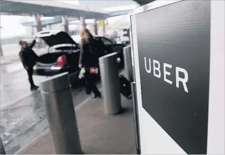  ?? Seth Wenig Associated Press ?? UBER’S release of data was seen as a first step to being more transparen­t. Above, an Uber pickup spot at LaGuardia Airport in New York.
