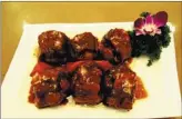  ??  ?? Yu Quan restaurant presents a menu of clean taste and authentic Muslim cuisine, featuring braised ox tail,