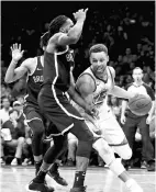  ??  ?? Stephen Curry #30 of the Golden State Warriors drives to the basket against DeMarre Carroll #9 of the Brooklyn Nets in the fourth quarter during their game at Barclays Center on November 19,2017 in the Brooklyn borough of New York City. - AFP photo