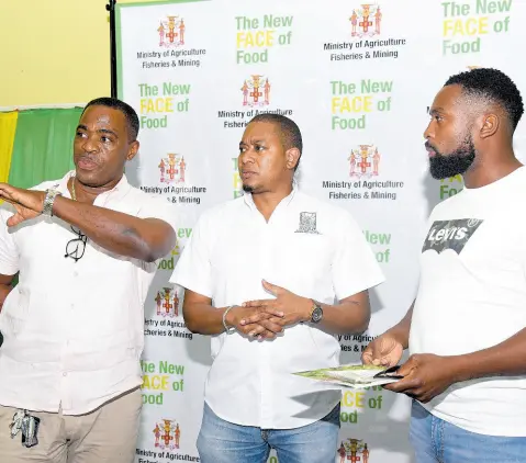  ?? ASHLEY ANGUIN/PHOTOGRAPH­ER ?? Agricultur­e Minister Floyd Green (centre) in conversati­on with Toney Ward (left) of the Rural Agricultur­al Developmen­t Authority and farmer Omaha Williams during the New FACE of Food stakeholde­r engagement session at the Holy Trinity Anglican Church in Westgate, Montego Bay, St James, on Wednesday.