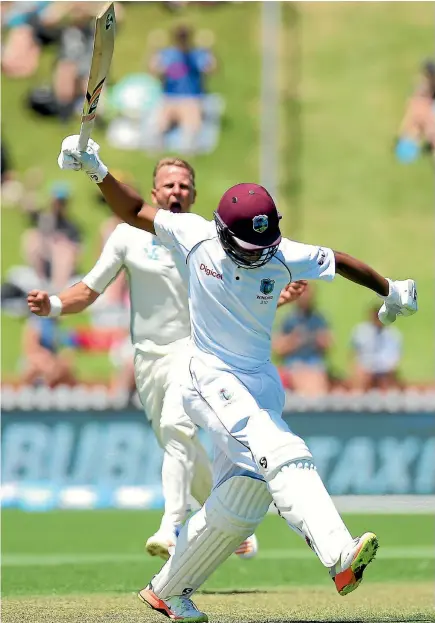  ?? PHOTO: GETTY IMAGES ?? Frustratio­n is evident as dismissed West Indies batsman Shimron Hetmyer takes aim at the turf while Neil Wagner celebrates in the background.