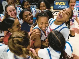  ?? ?? Princess Anne’s Zakiya Stephenson, center, is swarmed by teammates after the Cavaliers’ 53-45 victory over L.C. Bird in the Class 5 girls state championsh­ip game Saturday in Richmond. Stephenson finished with a game-high 24 points.