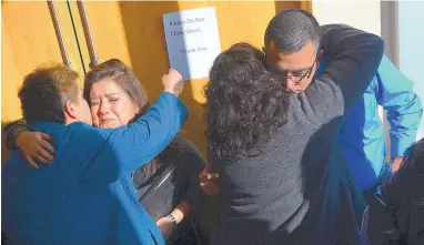  ?? ADOLPHE PIERRE-LOUIS/JOURNAL ?? Veronica Rael-Garcia, left, and her husband, Alan Garcia, are hugged after Tony Torrez entered his plea Thursday in the fatal October 2015 shooting of their 4-year-old daughter Lilly Garcia during a road rage incident on Interstate 40.