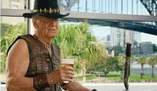  ?? PHOTO: TOURISM AUSTRALIA/AAP ?? KNIFE WORK: Paul Hogan in a Crocodile Dundee-inspired TV commercial for the 2018 Super Bowl.