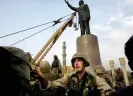  ?? ?? A statue of Saddam in Firdos Square, Baghdad, is pulled down by US marines, April 2003. Photograph: Trinity Mirror/Mirrorpix/Alamy