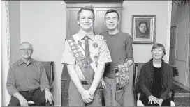  ??  ?? Pascal Tessier and his brother Lucien pose for a portrait with their parents at their home in Kensington, Md. The Boy Scouts’ New York chapter hired Pascal Tessier, an openly gay Eagle Scout, as a summer camp leader.
JACQUELYN MARTIN
ASSOCIATED PRESS