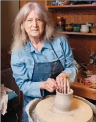 ?? RUSTY HUBBARD/THREE RIVERS EDITION ?? Becki Dahlstedt throws clay on a potter’s wheel in her home studio in Mountain View.