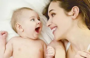  ?? Istockphot­os ?? Smiling at your baby helps you connect with your child, and makes your baby feel secure and safe.