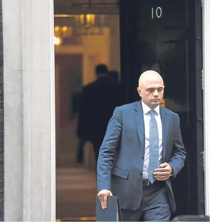  ?? Picture: PA. ?? Newly-appointed home secretary Sajid Javid, left, leaves Downing Street after a meeting yesterday.