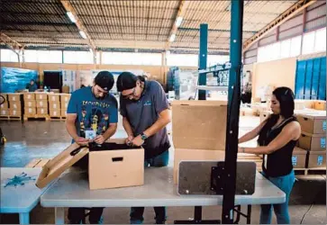  ?? Jose Cabezas
Afp/getty Images ?? ELECTION WORKERS in the capital prepare data-transmissi­on packages. More than 20 years after the end of a civil war in which more than 75,000 people died, choices remain stark in the tiny Central American nation.