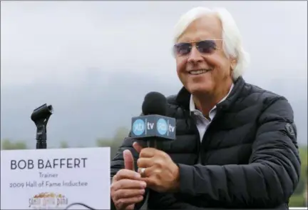  ?? DAMIAN DOVARGANES — THE ASSOCIATED PRESS ?? In this photo, Hall of Fame trainer Bob Baffert takes questions about horse Justify at Santa Anita Park in Arcadia The only thing Baffert wanted to do in horse racing was win the Triple Crown.