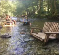  ?? TRIBUNE NEWS SERVICE ?? A river runs through the Big Sur River Inn and guests are encouraged to get their feet wet.